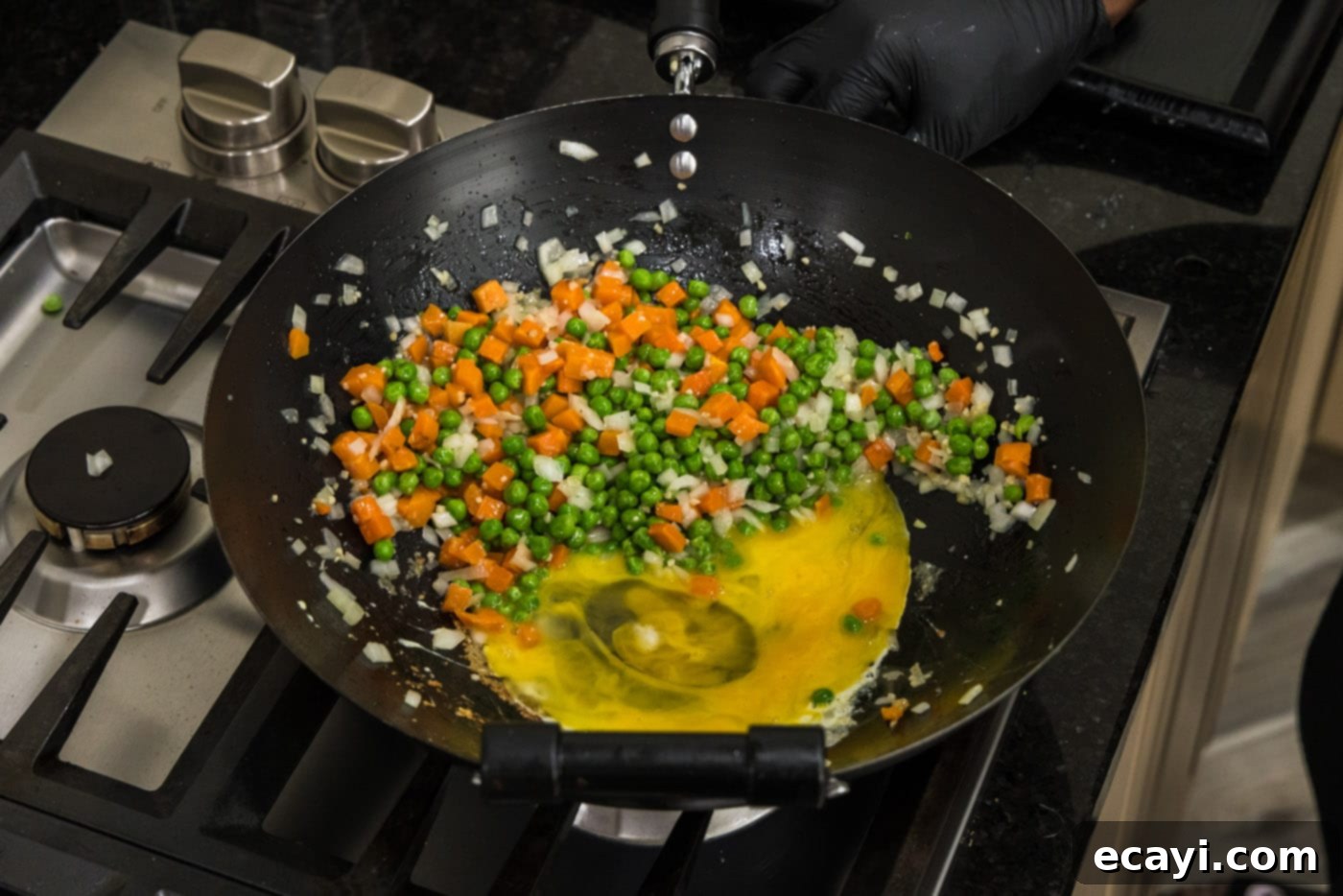Golden Shrimp Fried Rice 10 eggs scrambling next to stir fried vegetables