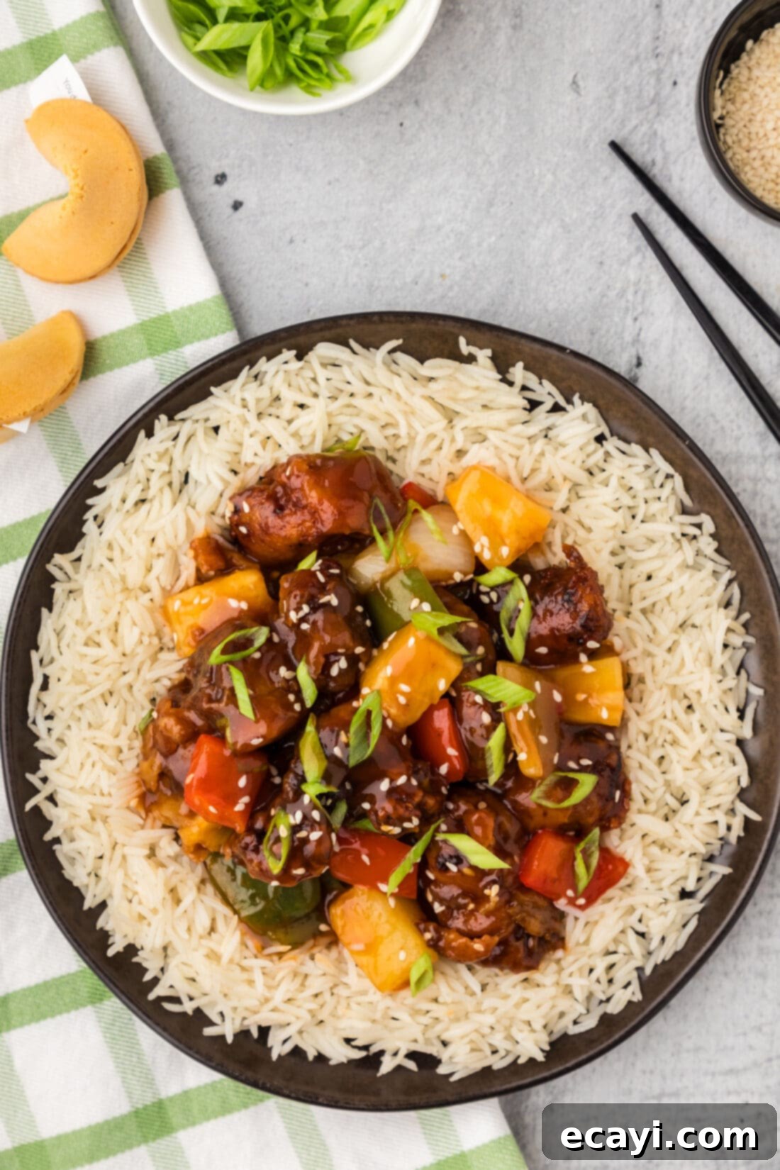 Tangy Glazed Pork Delight 2 Sweet and Sour Pork served on a plate over rice