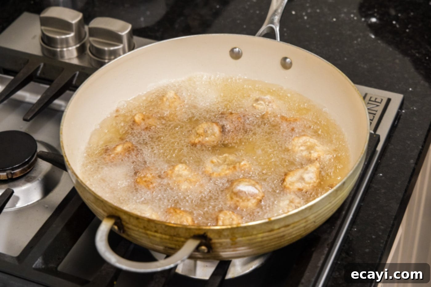 Tangy Glazed Pork Delight 11 frying dredged pork in hot oil