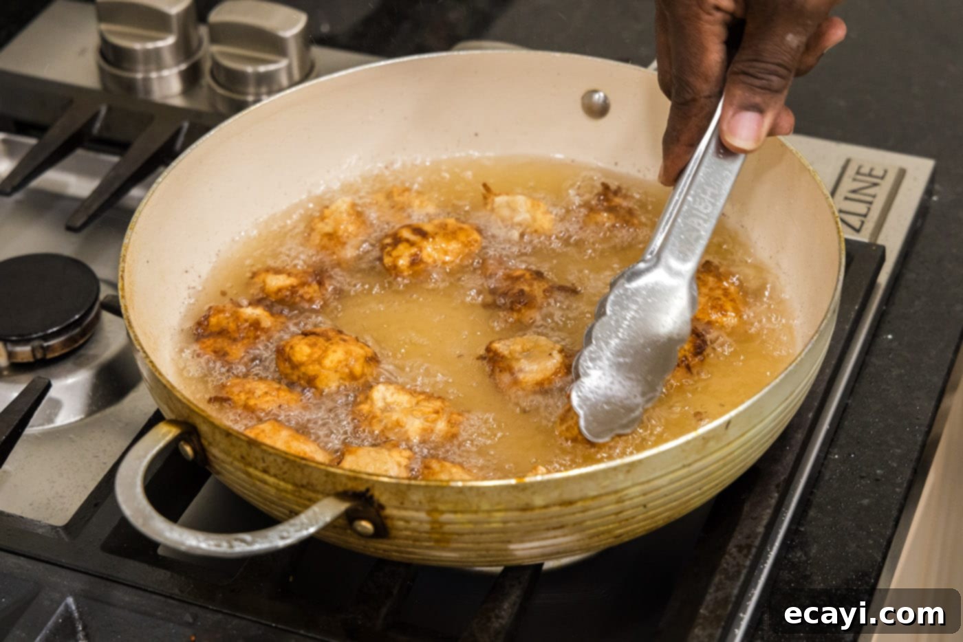 Tangy Glazed Pork Delight 12 tongs flipping fried pork in oil