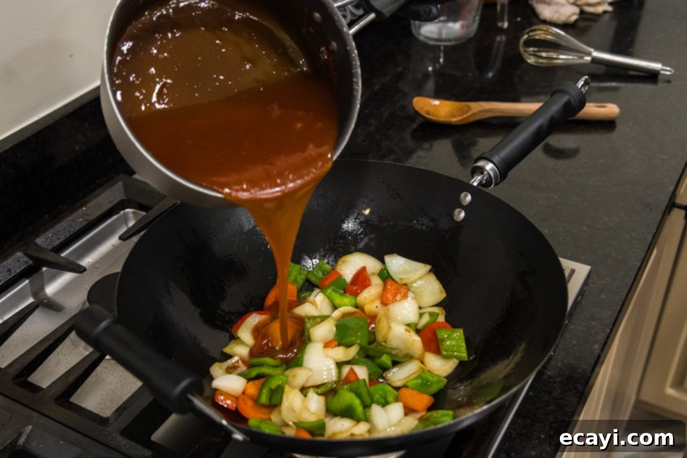 Tangy Glazed Pork Delight 15 pouring sweet and sour sauce over stir fried vegetables