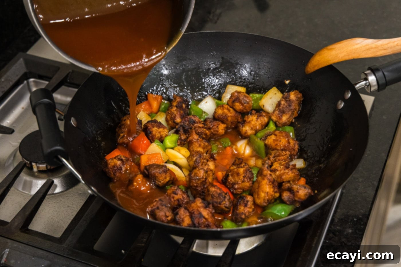 Tangy Glazed Pork Delight 16 pouring sweet and sour sauce over chicken and stir fried veggies