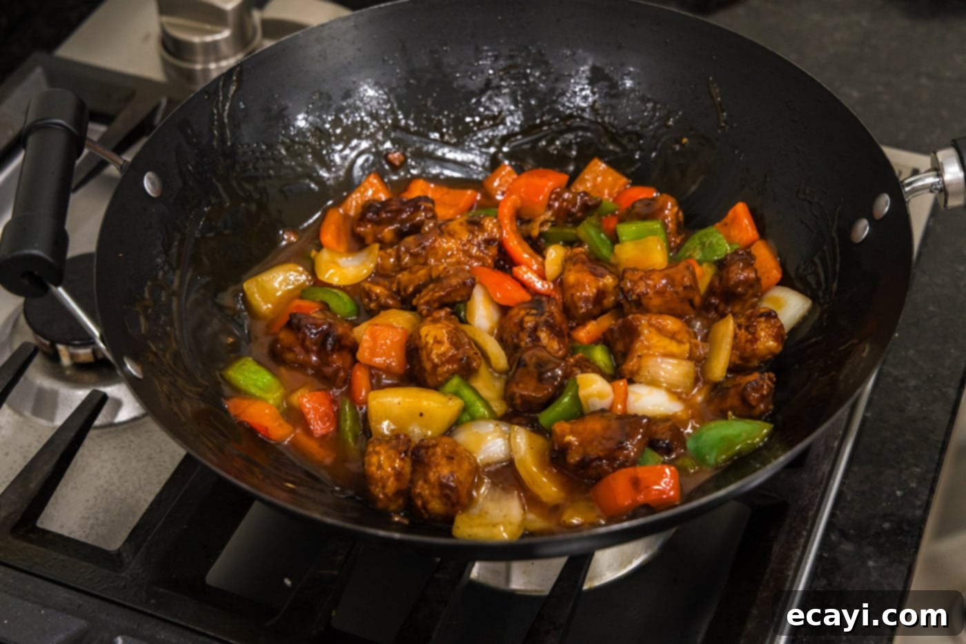 Tangy Glazed Pork Delight 17 sweet and sour pork in a wok