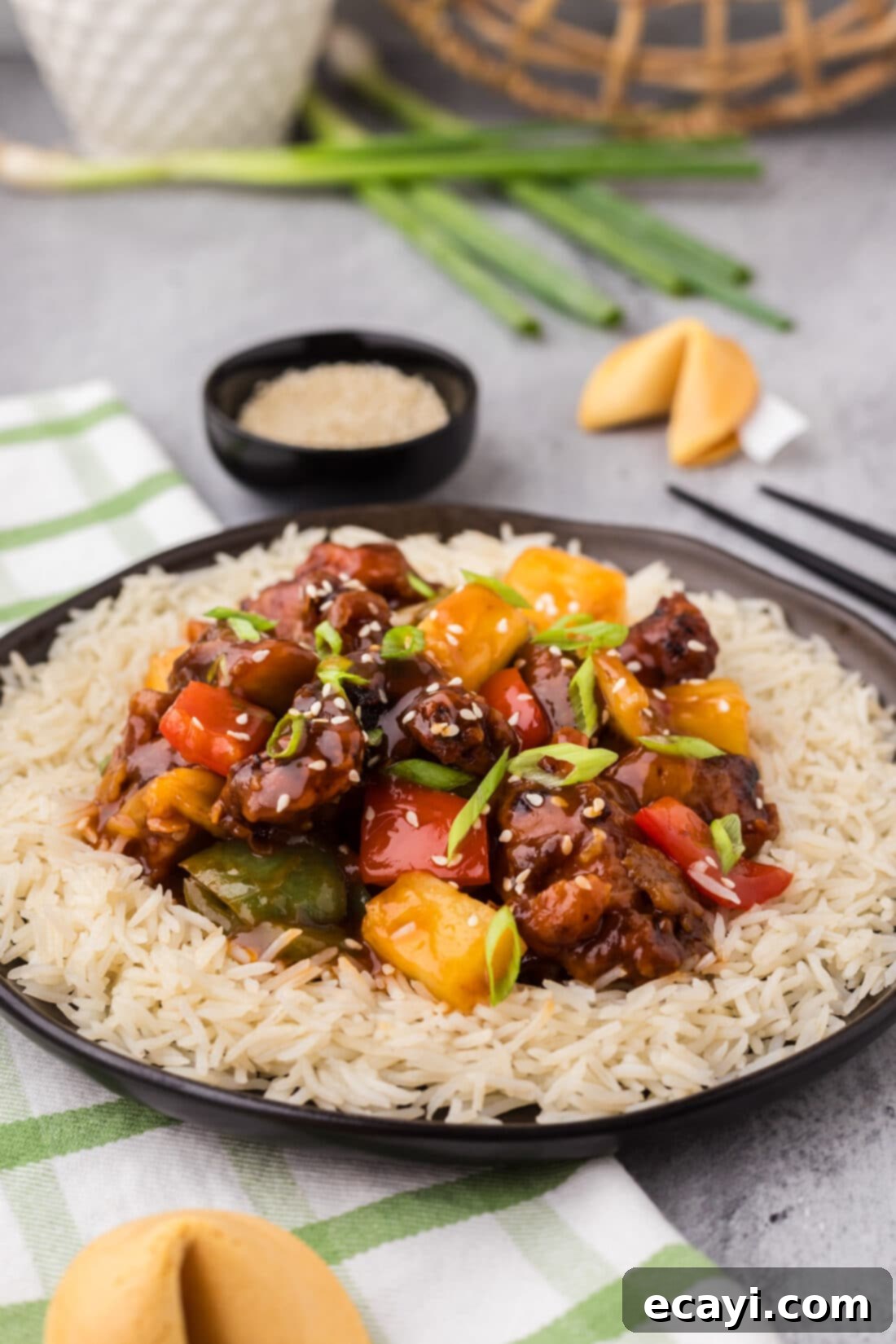 Tangy Glazed Pork Delight 18 Plate of Sweet and Sour Pork and rice on a plate