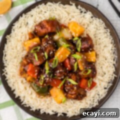 Tangy Glazed Pork Delight 19 Overhead photo of Sweet and Sour Pork served over rice
