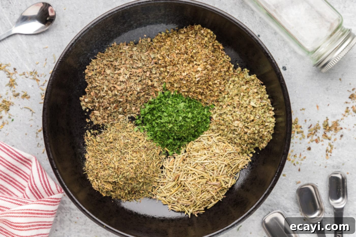 Classic Italian Herb Blend 5 dried herbs in a bowl, ready to be mixed for homemade Italian seasoning