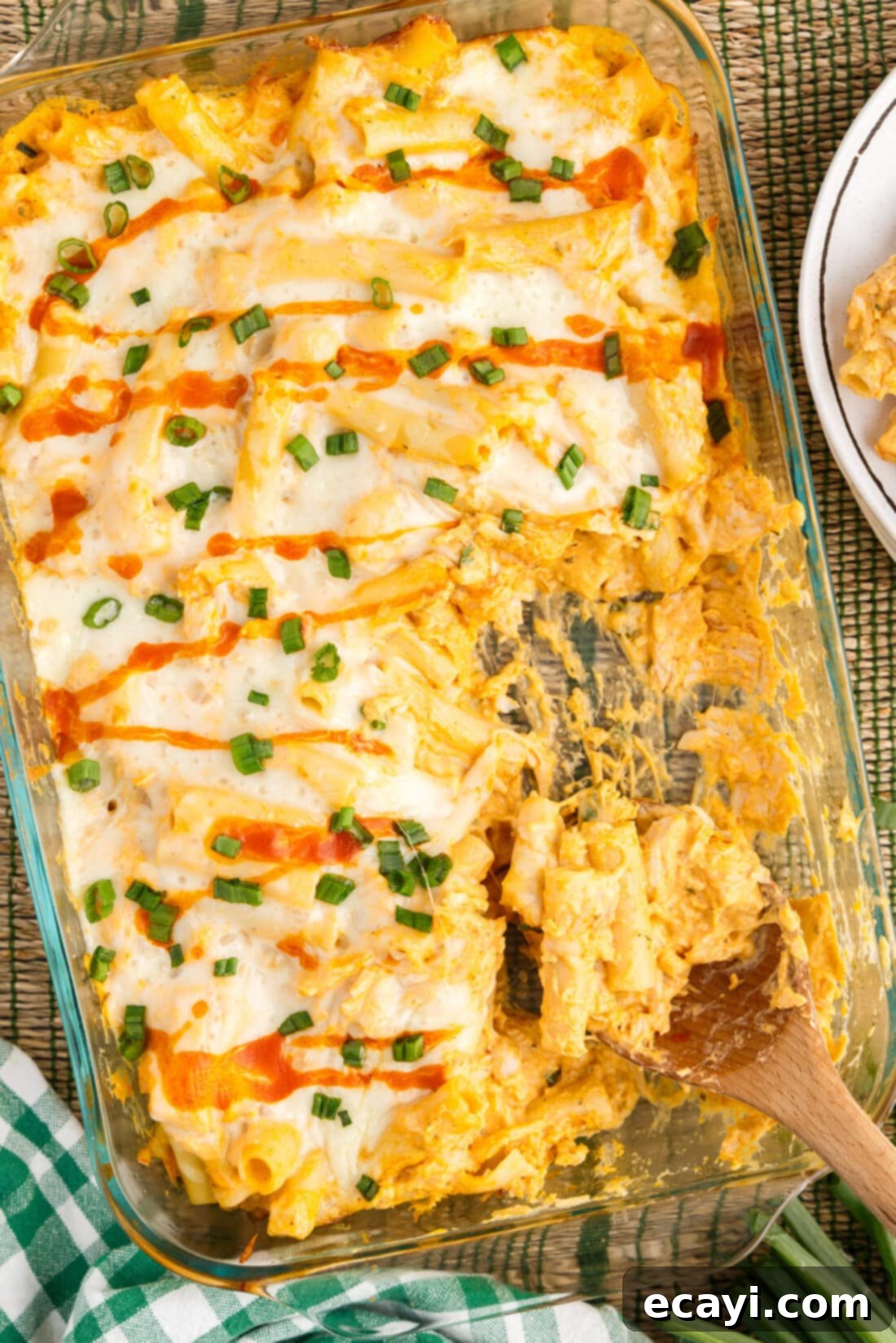Fiery Chicken Comfort Bake 2 Dish of Buffalo Chicken Casserole with a spoon in it
