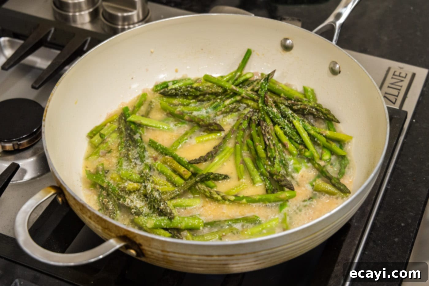Bright Asparagus Pasta 7 Fresh asparagus spears added to the melted butter, garlic, and shallot mixture simmering in a skillet.