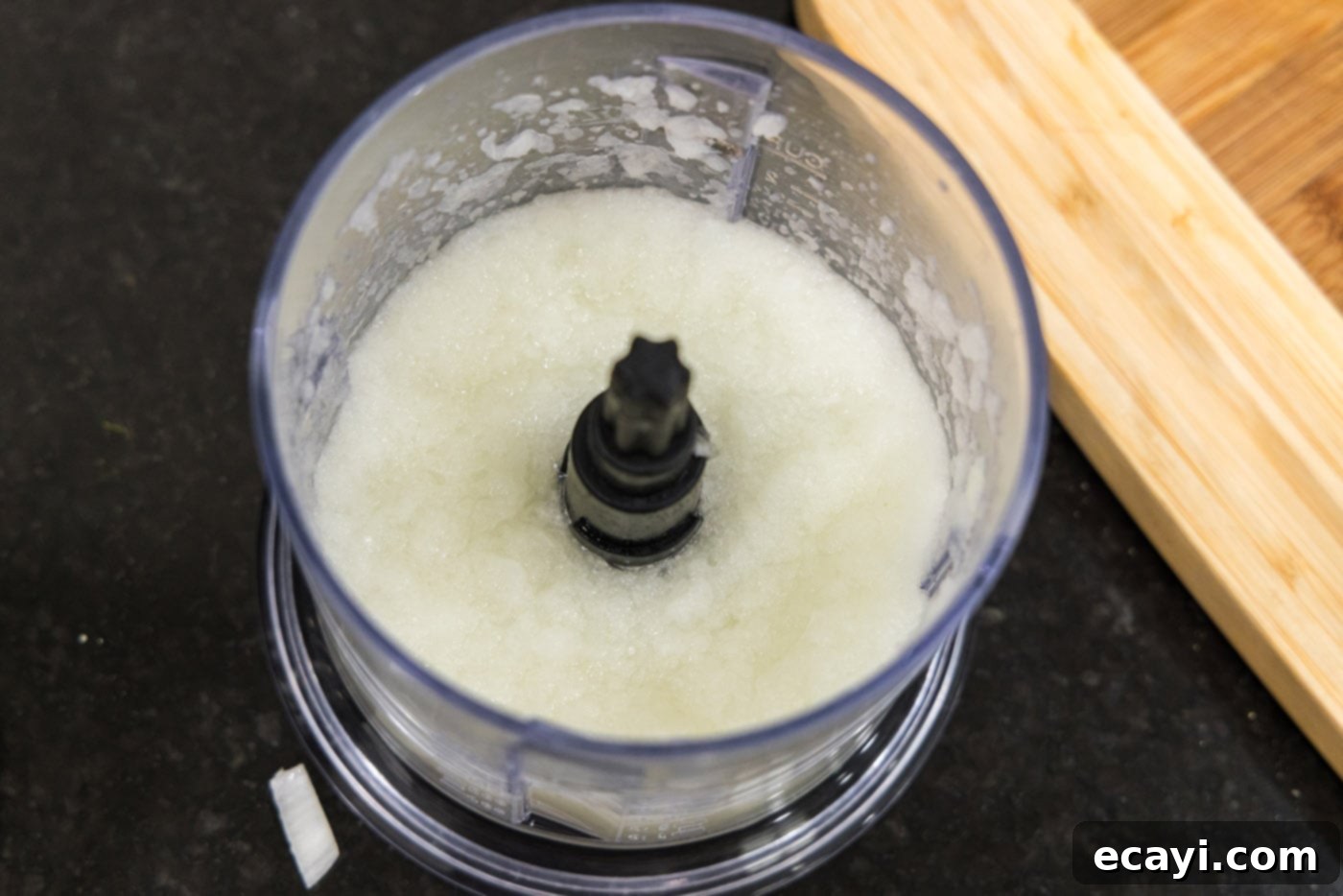 Tender Instant Pot BBQ Chicken 6 Finely minced onion in a food processor, ready for adding to the Instant Pot.