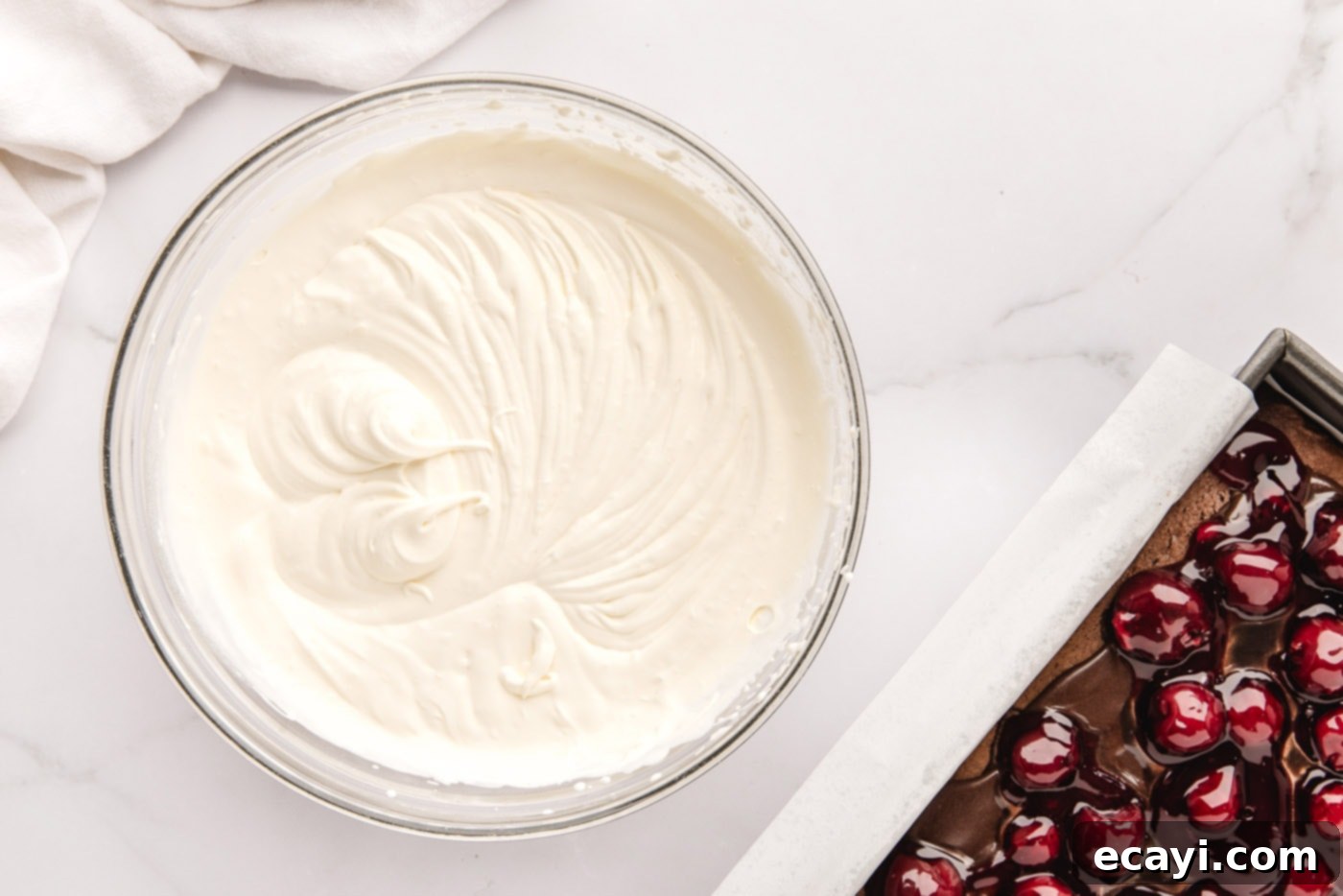 Decadent Black Forest Poke Cake 11 homemade whipped cream in a mixing bowl