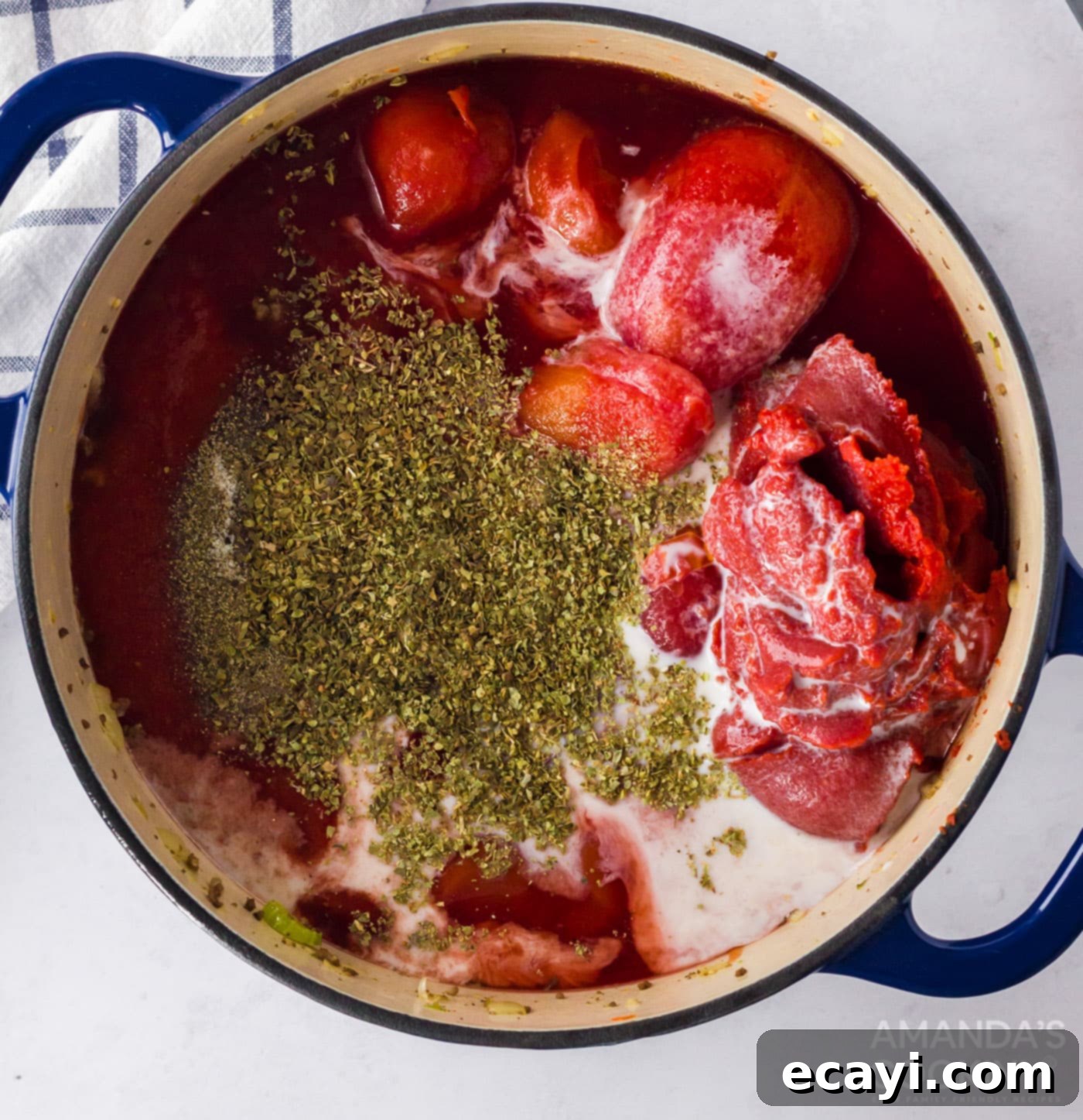 Hearty Bolognese Ragù 7 All the essential ingredients for Bolognese sauce, including various tomato products, wine, and milk, combined in a large pot before simmering.