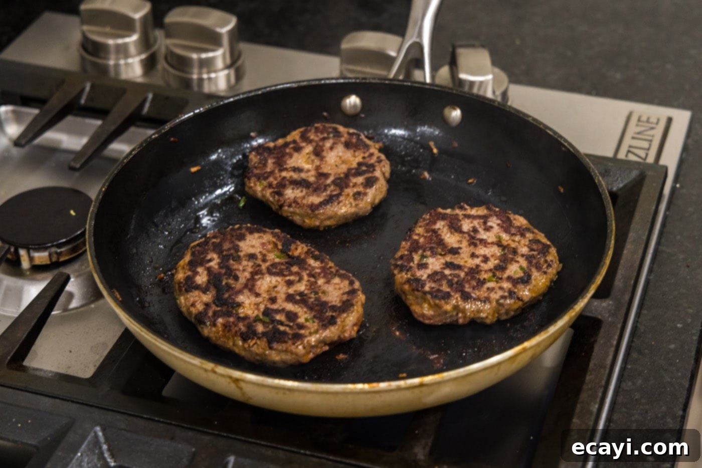 Premium Bison Burger 11 cooked buffalo burgers in a skillet