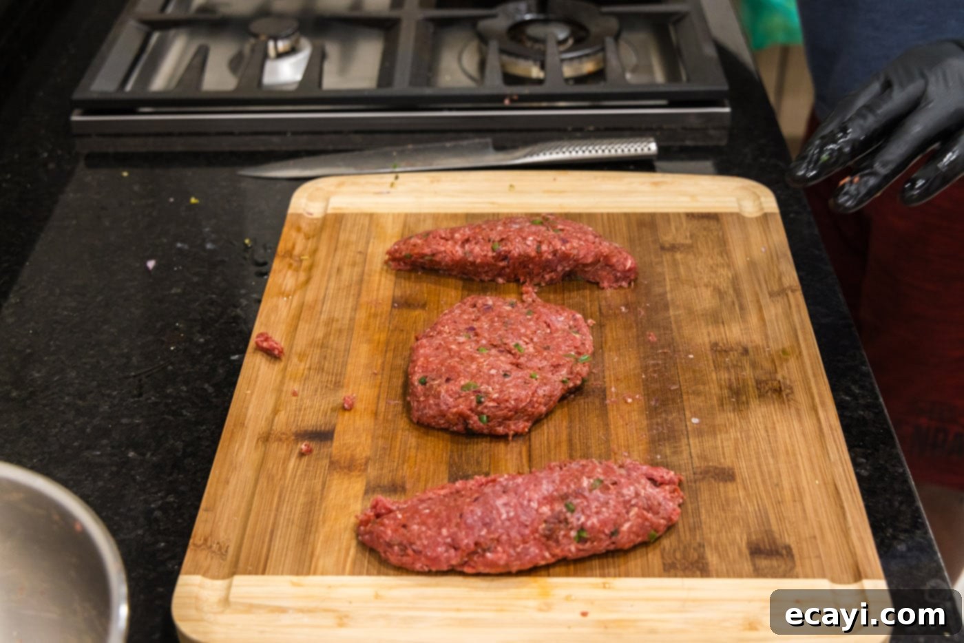Premium Bison Burger 8 ground bison patties on a cutting board