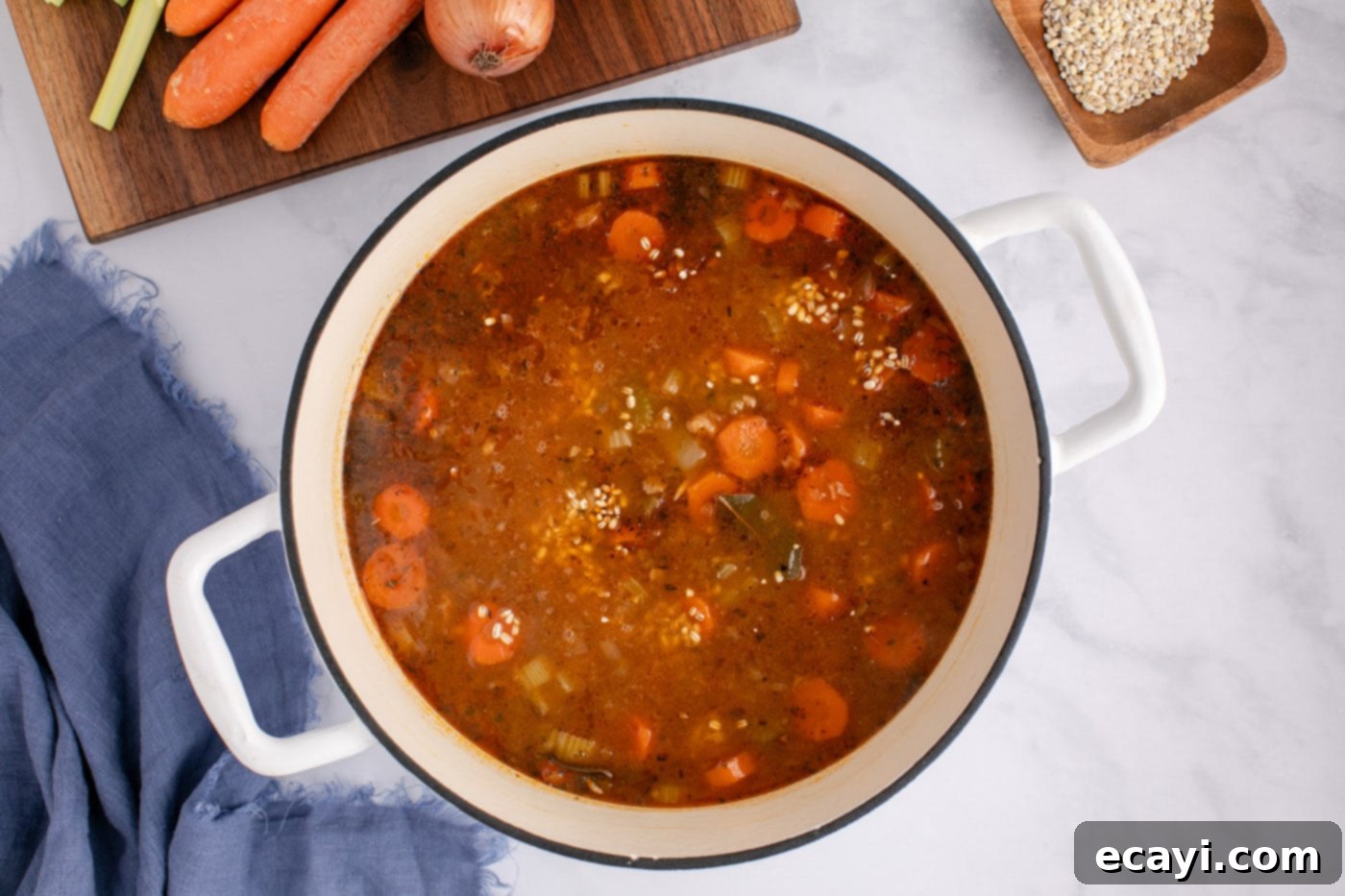 Wholesome Beef and Barley Comfort 13 Beef barley soup with pearl barley cooking in a stockpot, enriching the broth.