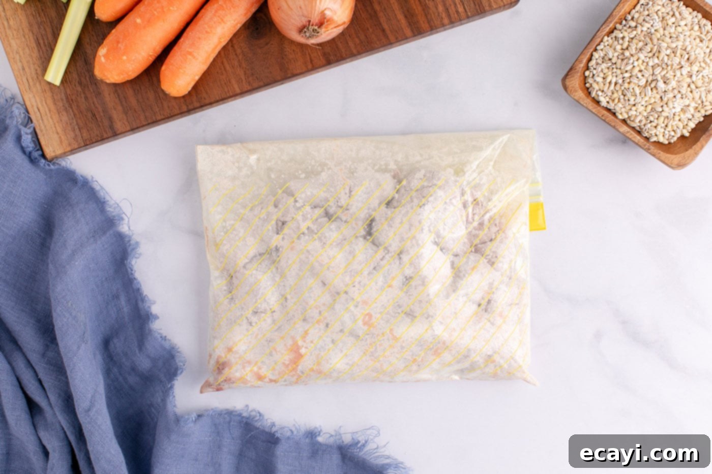 Wholesome Beef and Barley Comfort 6 Close-up of flour-coated beef cubes in a Ziploc bag, illustrating even coverage.