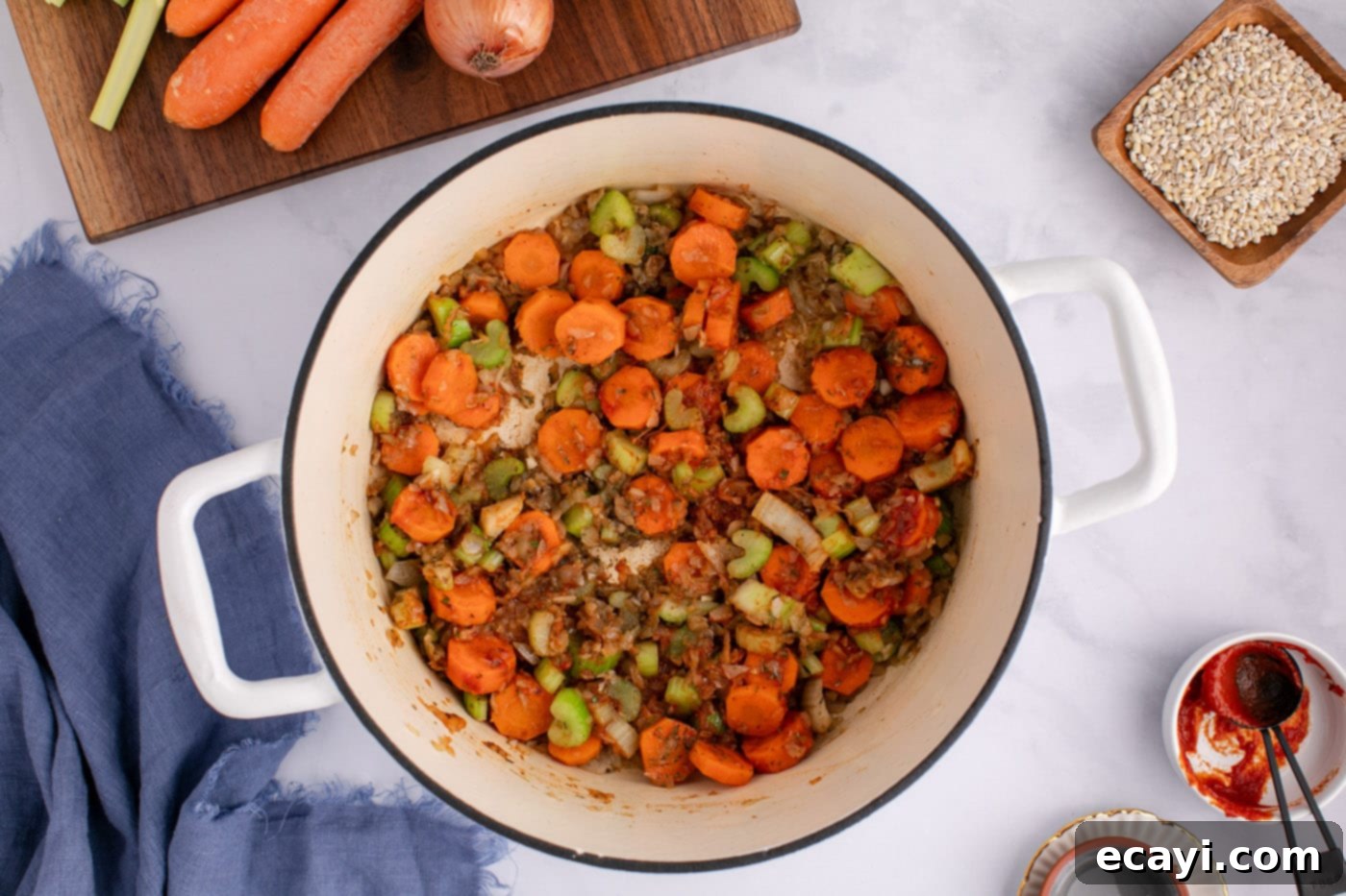 Wholesome Beef and Barley Comfort 10 Cooked aromatic vegetables in a soup pot, perfectly softened and fragrant.