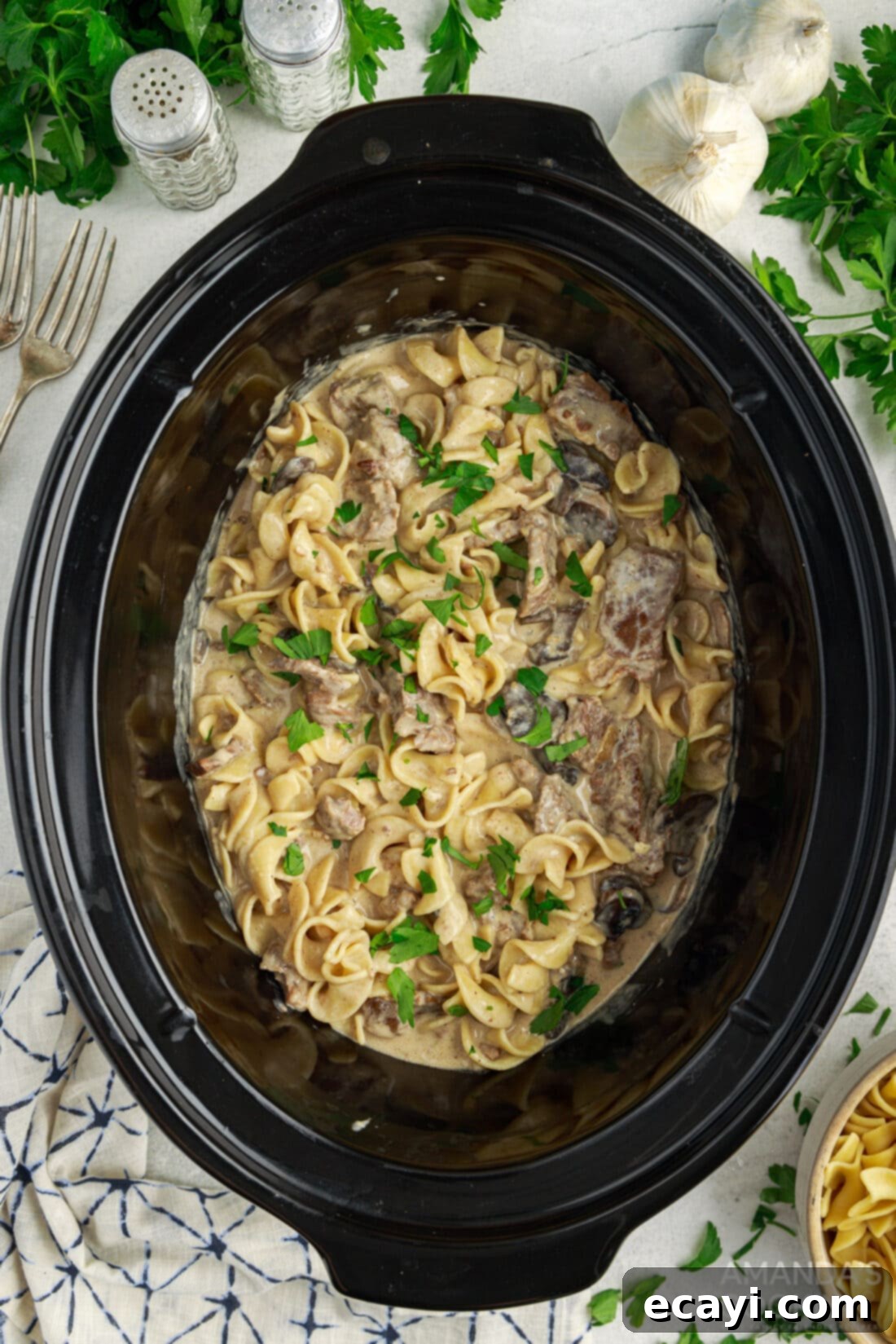 Unlocking Your Slow Cooker 6 A hearty Crockpot Beef Stroganoff, rich with creamy sauce and tender beef, served in a slow cooker, promising a comforting and effortless meal.