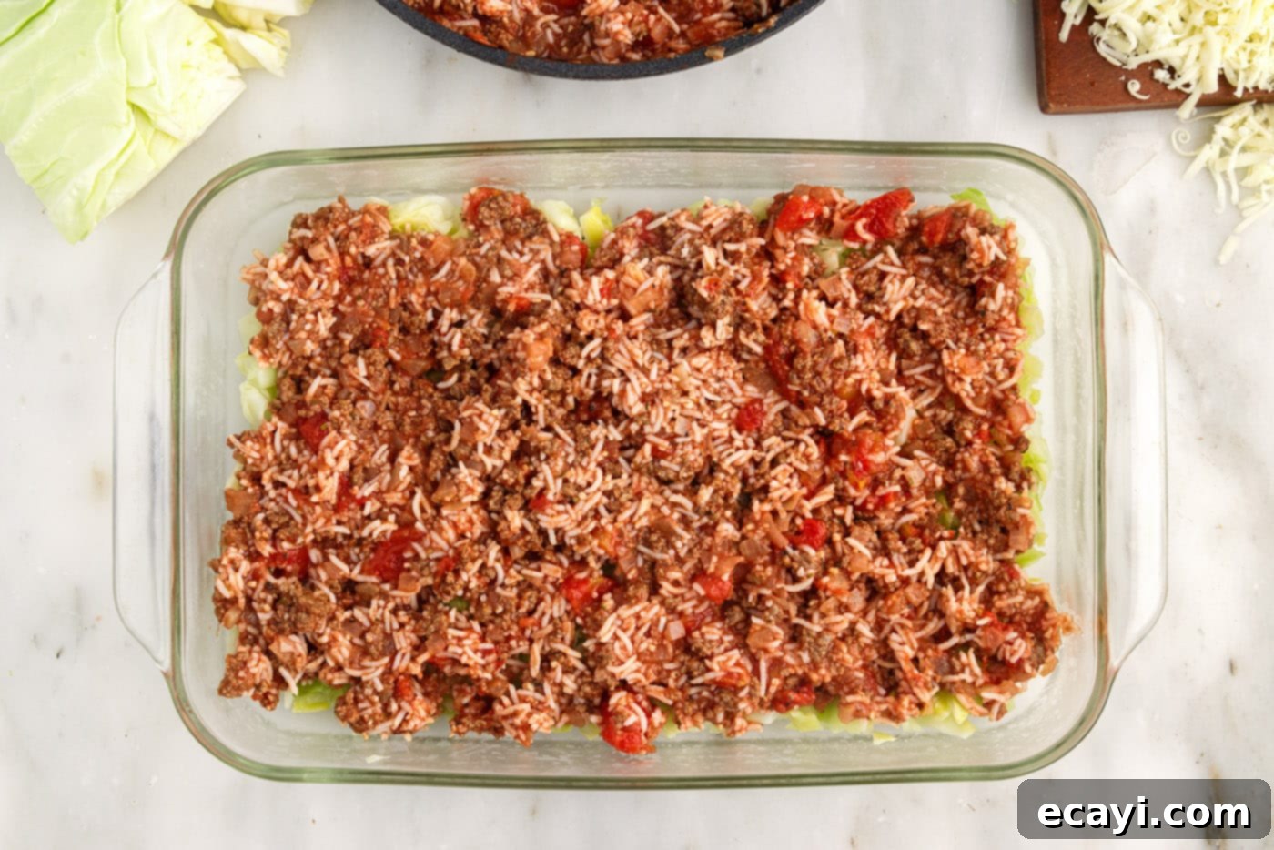 Hearty Cabbage Roll Bake 12 ground beef and rice mixture layered on top of cabbage in a baking dish