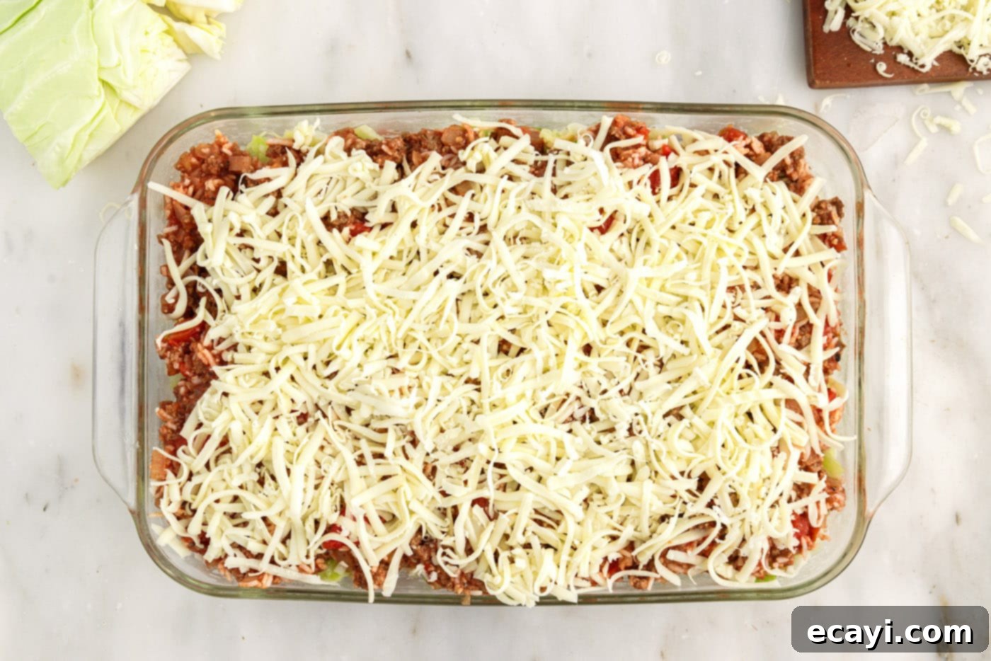 Hearty Cabbage Roll Bake 13 shredded cheese generously topping the layered cabbage roll casserole