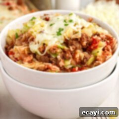 Hearty Cabbage Roll Bake 16 Bowl of Cabbage Roll Casserole with a fork, ready to eat