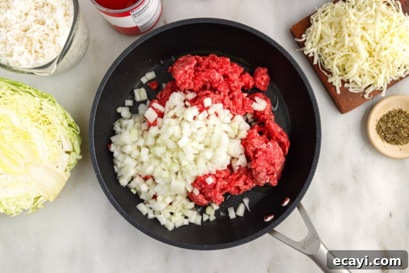 Hearty Cabbage Roll Bake 5 ground beef and onion sizzling in a skillet