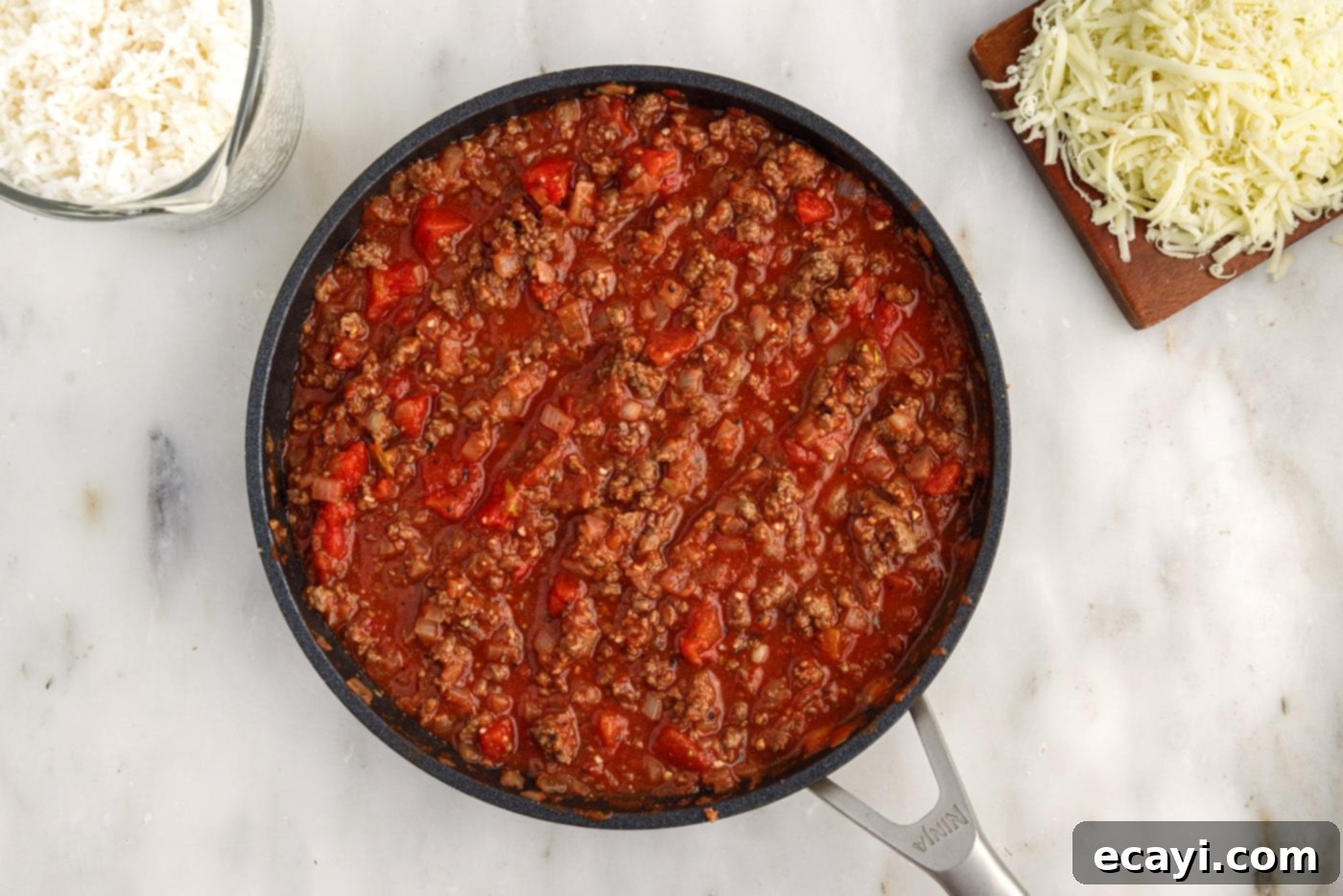 Hearty Cabbage Roll Bake 8 cabbage roll filling with tomatoes simmering in a skillet