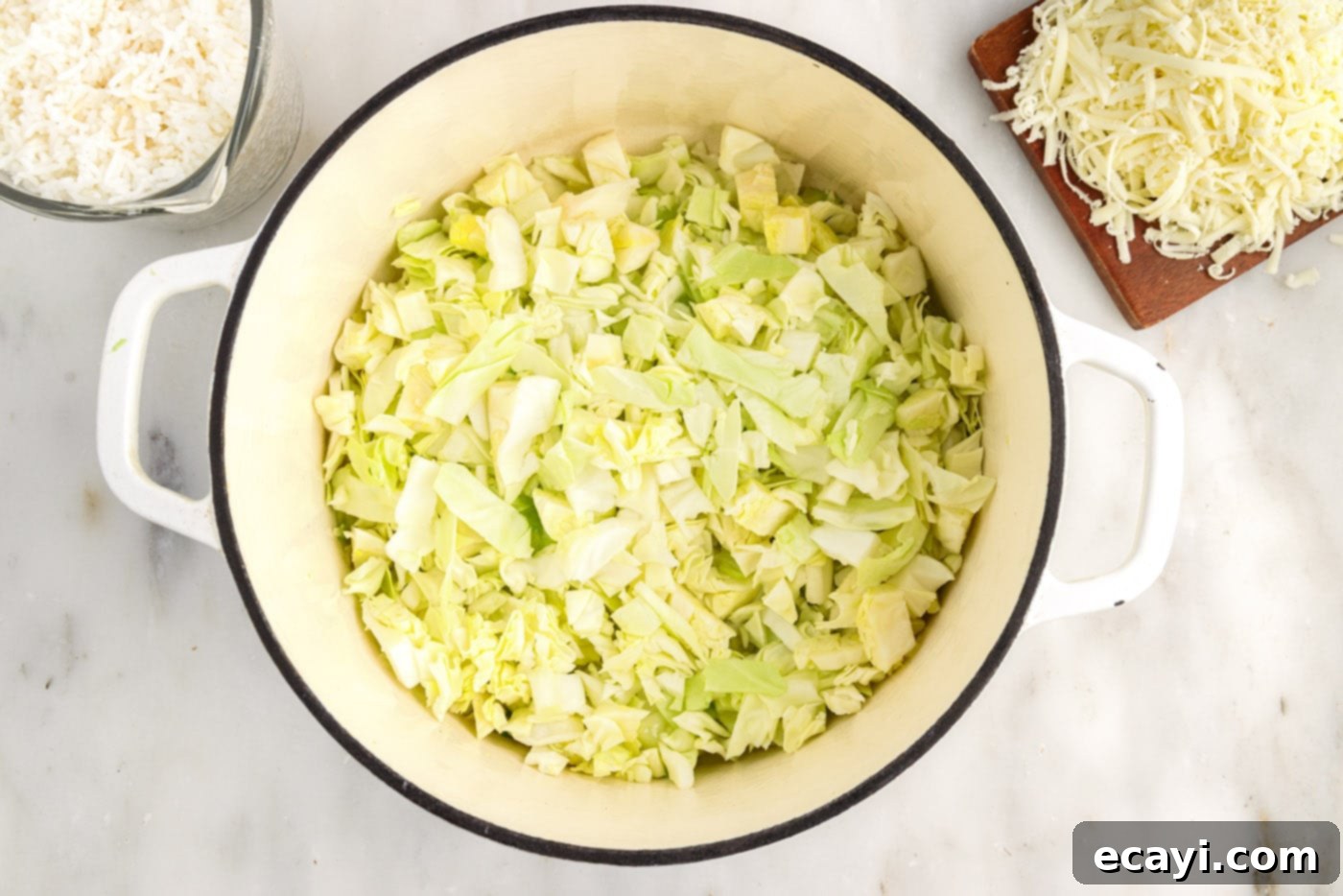 Hearty Cabbage Roll Bake 10 chopped cabbage wilting in a large pot with olive oil