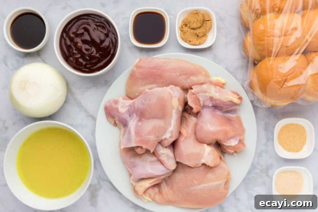 Mini BBQ Chicken Sandwiches 4 Ingredients for BBQ Chicken Sliders laid out on a kitchen counter, including chicken, sauces, and spices.