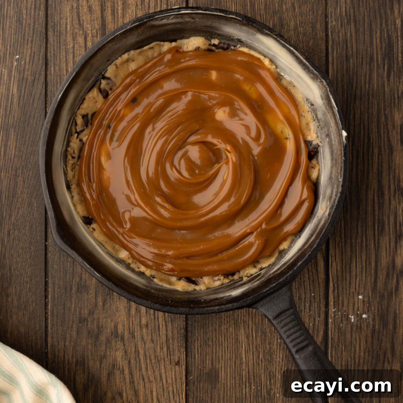 Molten Skillet Chocolate Caramel Cookie 15 layer of salted caramel sauce over cookie dough in a skillet