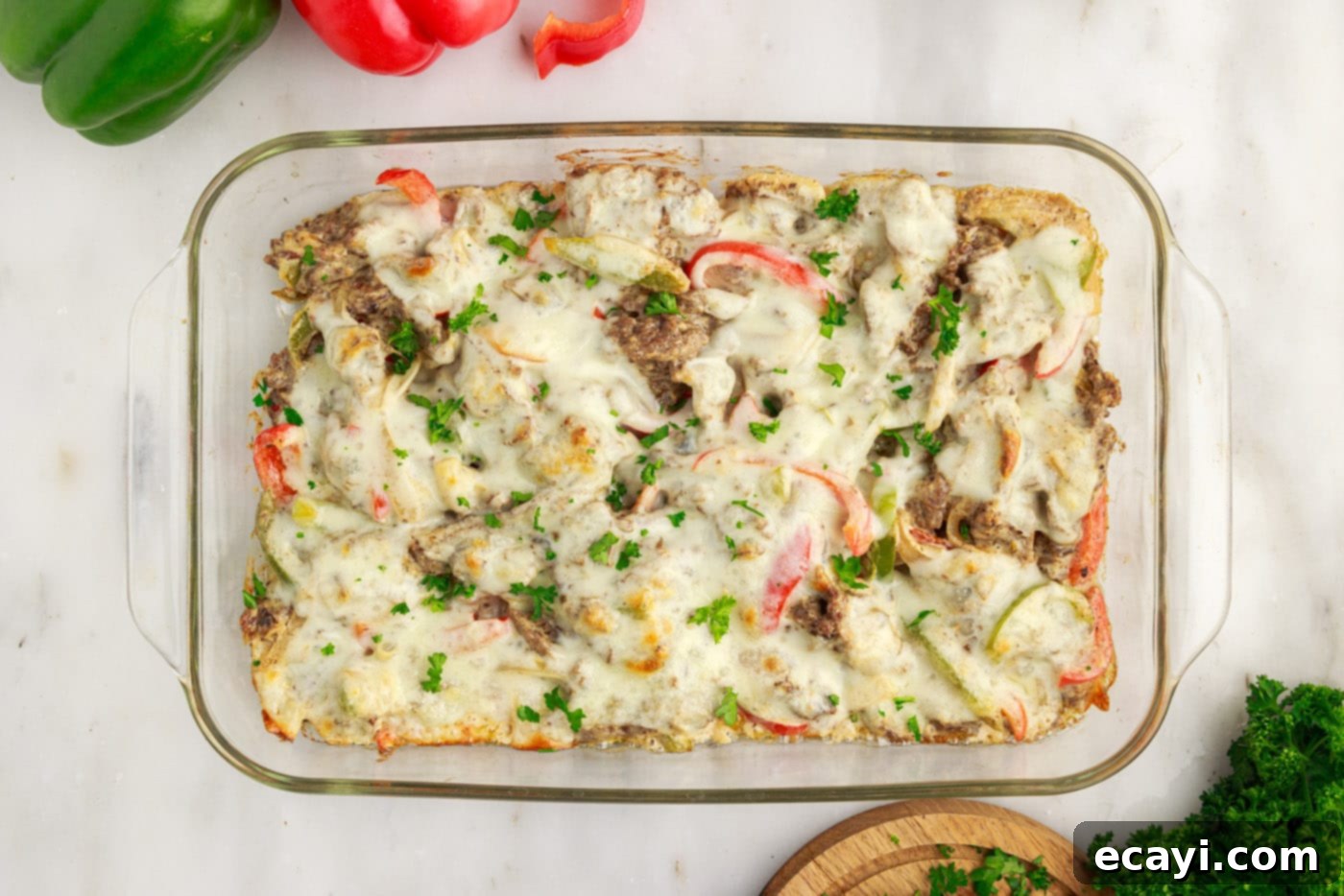 Hearty Philly Cheesesteak Casserole 16 Overhead view of an easy Philly cheesesteak casserole fresh from the oven, golden and bubbly