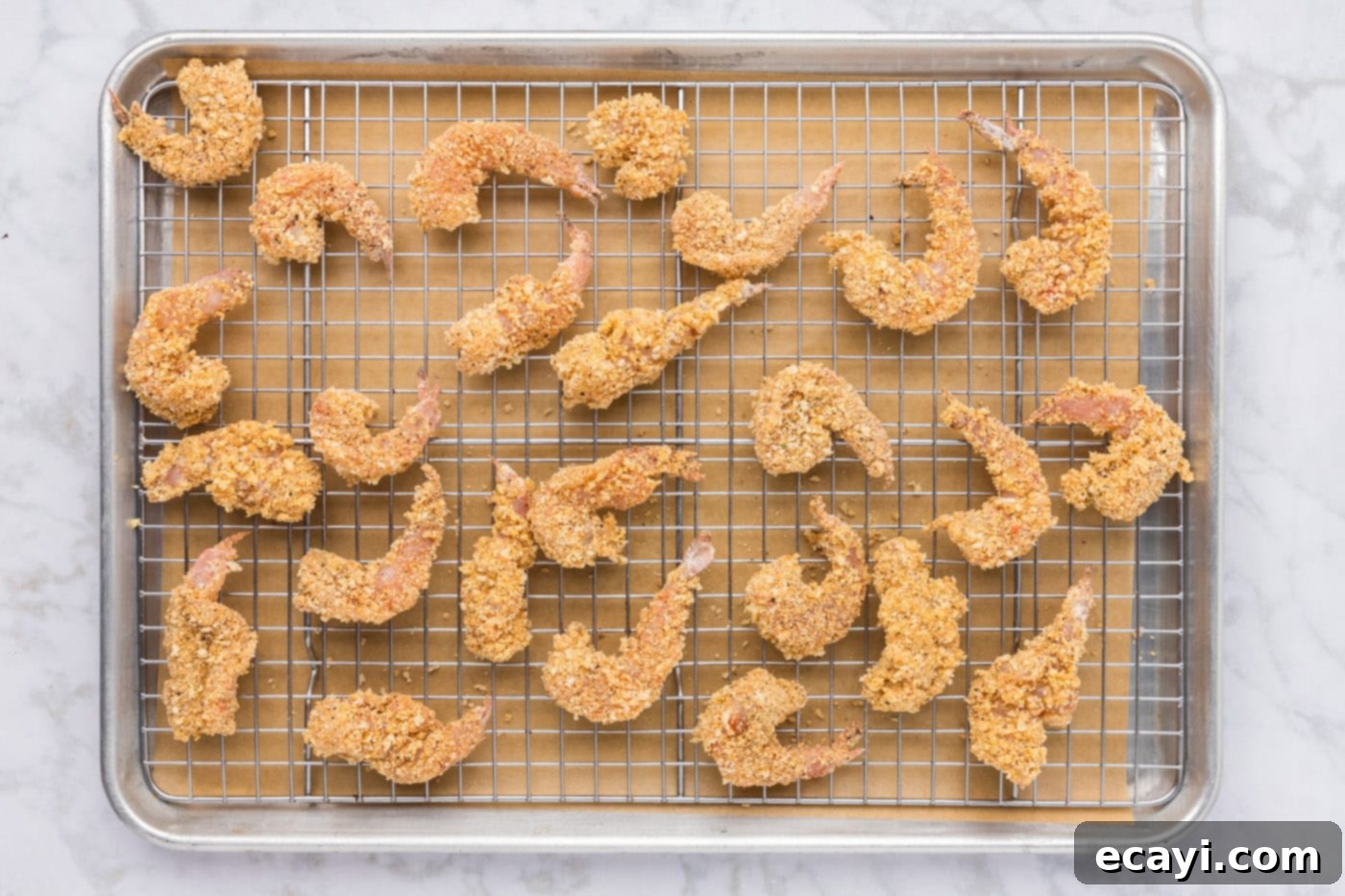 Crispy Fried Shrimp 11 breaded shrimp on a baking sheet