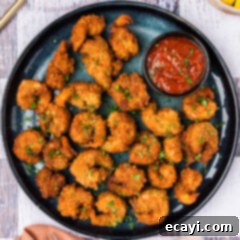 Crispy Fried Shrimp 15 Breaded Shrimp on a plate with a bowl of cocktail sauce