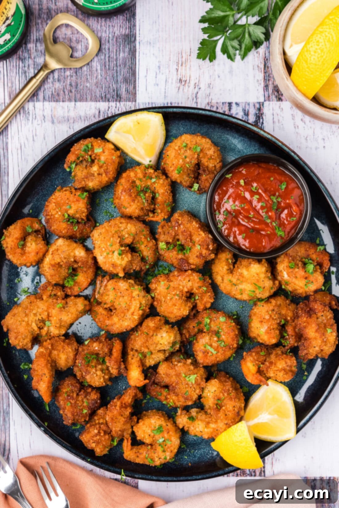 Crispy Fried Shrimp 3 Breaded Shrimp on a plate with lemon wedges