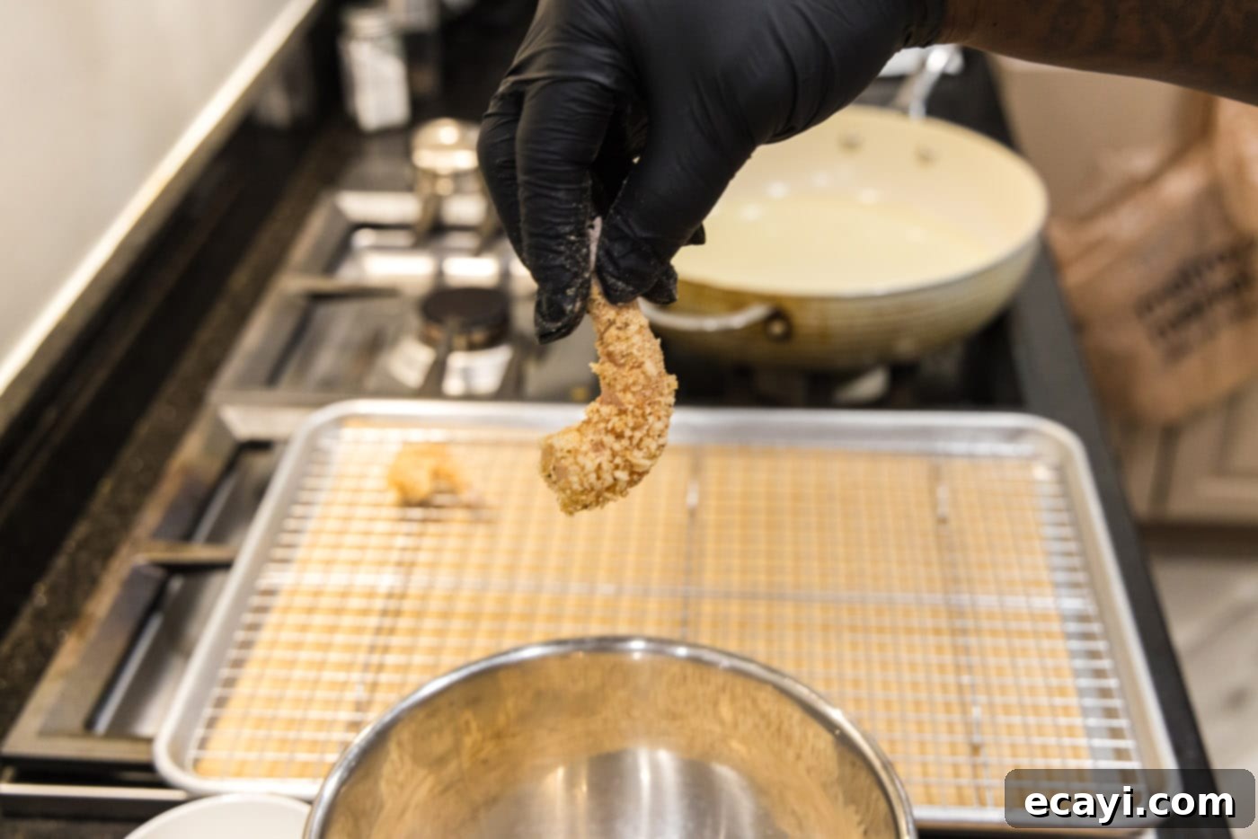 Crispy Fried Shrimp 10 hand holding breaded shrimp
