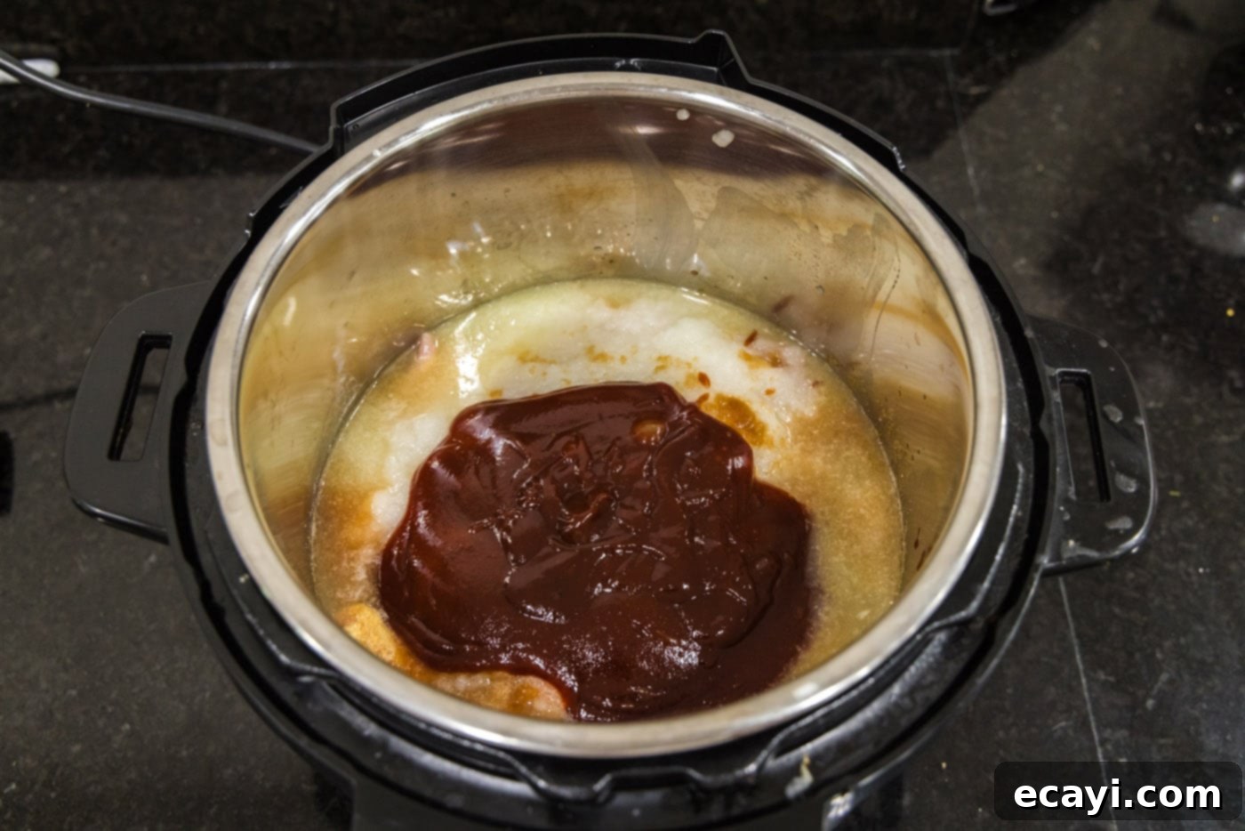 Smoky BBQ Chicken Sandwich 10 Barbecue sauce generously added over the chicken and other ingredients in the Instant Pot.
