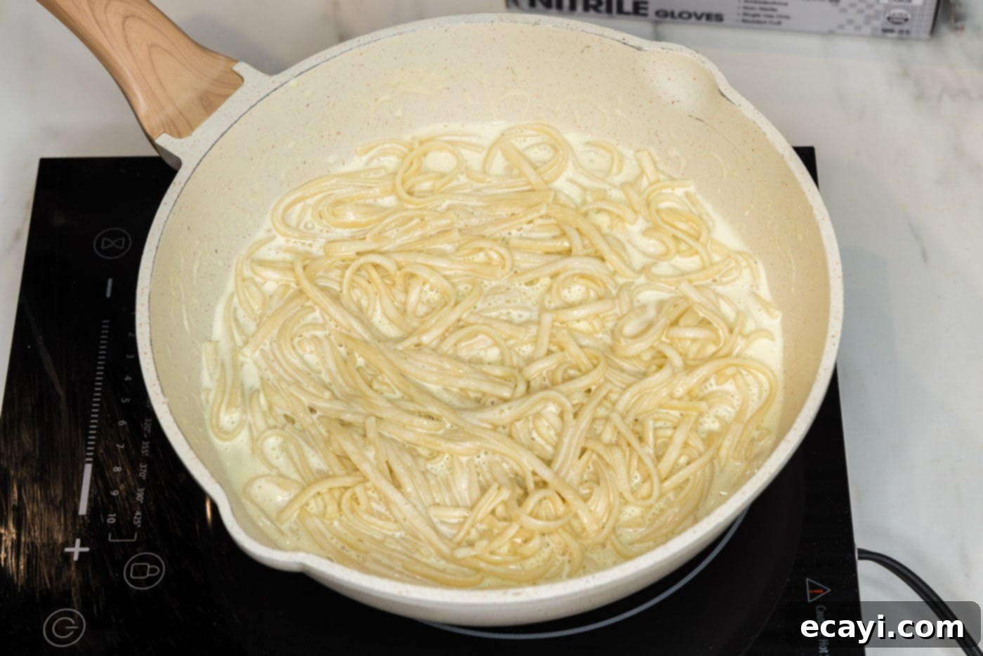Decadent Lobster Pasta 19 linguine noodles in skillet with lobster sauce