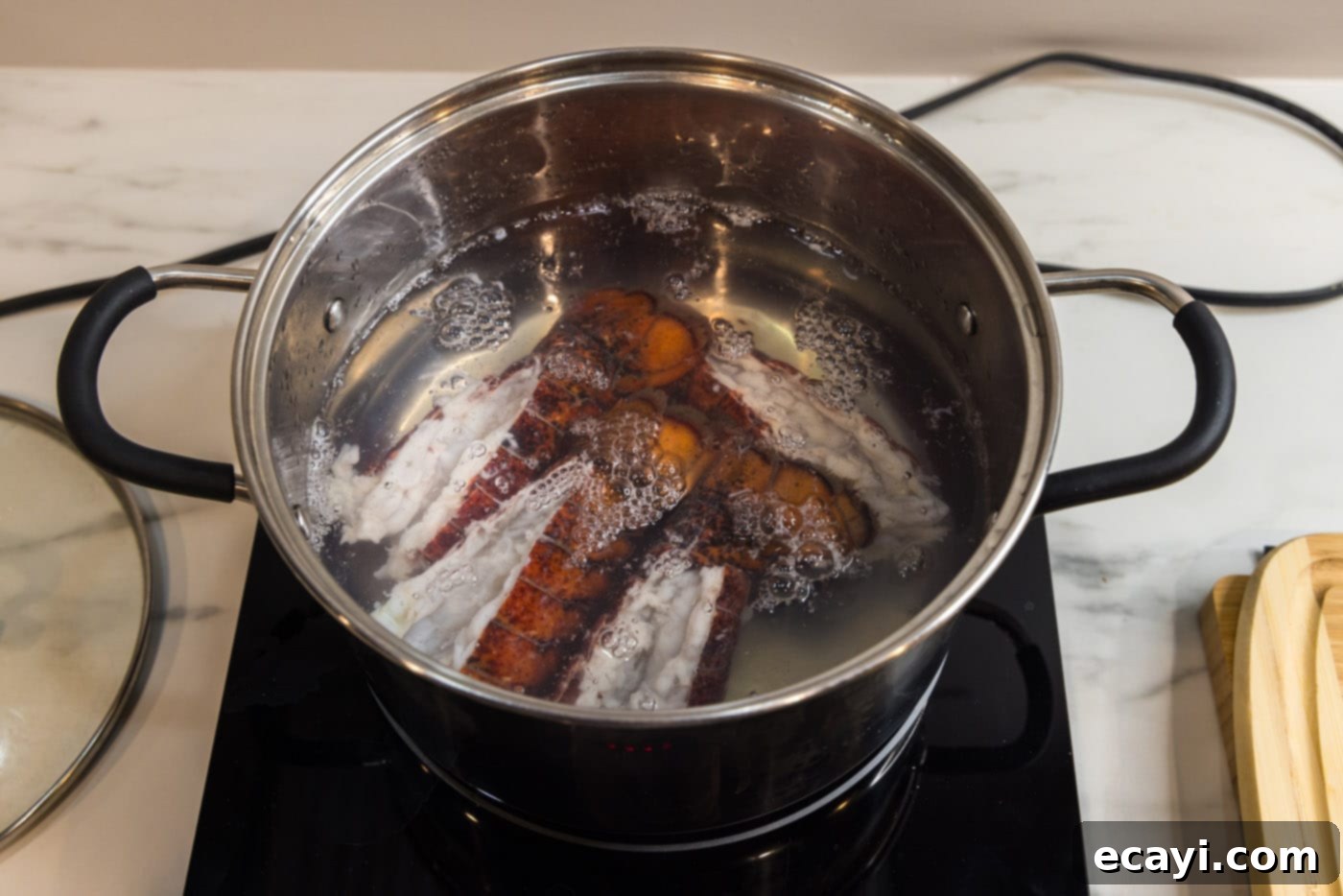 Decadent Lobster Pasta 8 lobster tails cooking in a stockpot