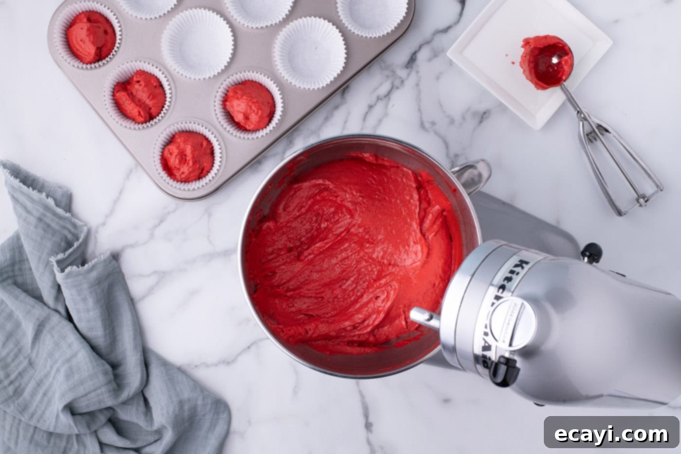 Decadent Red Velvet Treats 13 The finished, perfectly mixed red velvet cupcake batter resting in a mixer bowl, ready for baking.