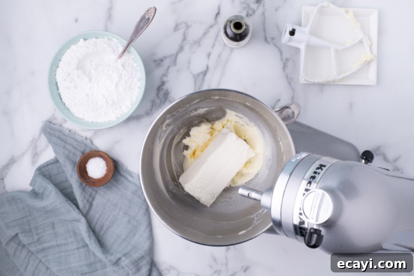 Decadent Red Velvet Treats 15 Beating softened cream cheese with butter in a mixer bowl until perfectly smooth for a lump-free frosting.
