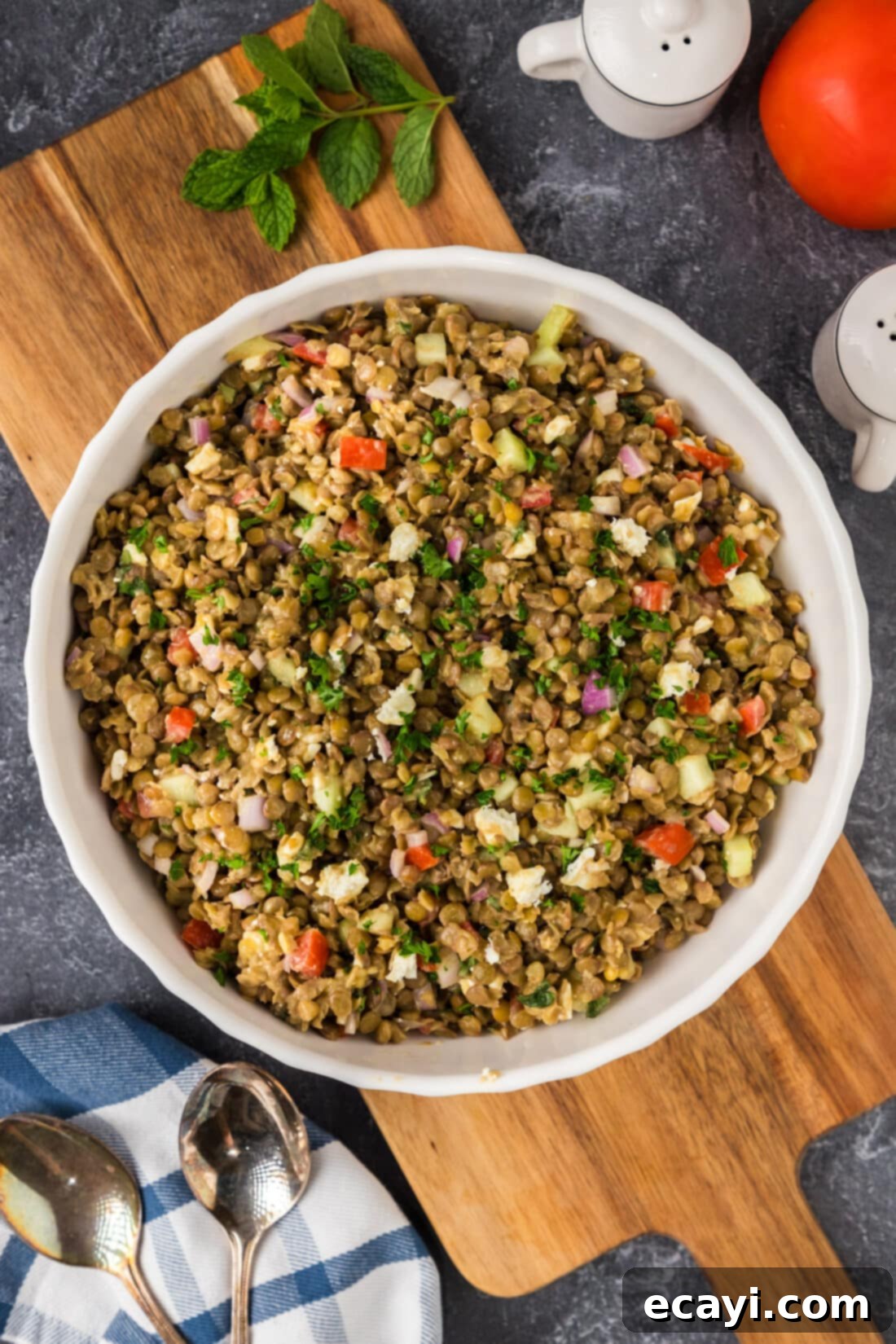 Zesty Lemon Herb Lentil Salad 2 Lentil Salad in a bowl resting on a wooden platter