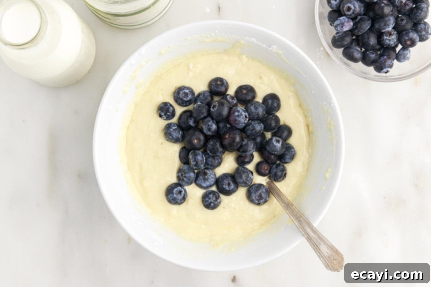 Bursting Blueberry Breakfast Flapjacks 9 folding fresh blueberries into pancake batter