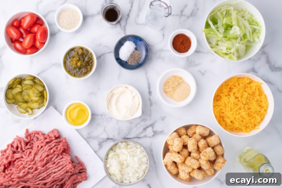 Special Sauce Cheeseburger Casserole 4 Various ingredients for Big Mac Casserole laid out on a white surface