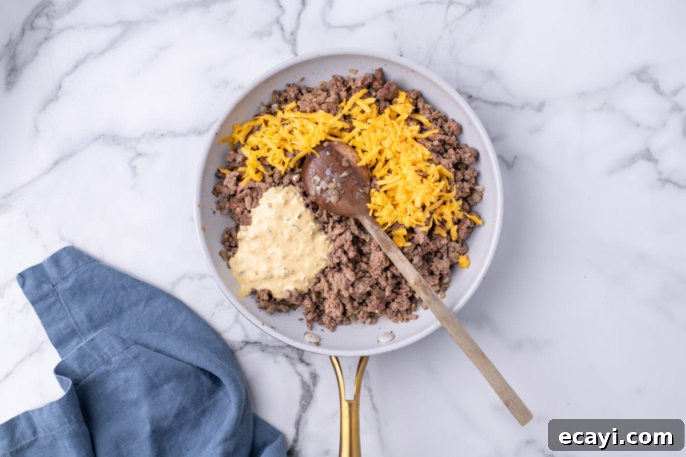 Special Sauce Cheeseburger Casserole 9 Big Mac sauce and shredded cheese added to ground beef mixture in a skillet