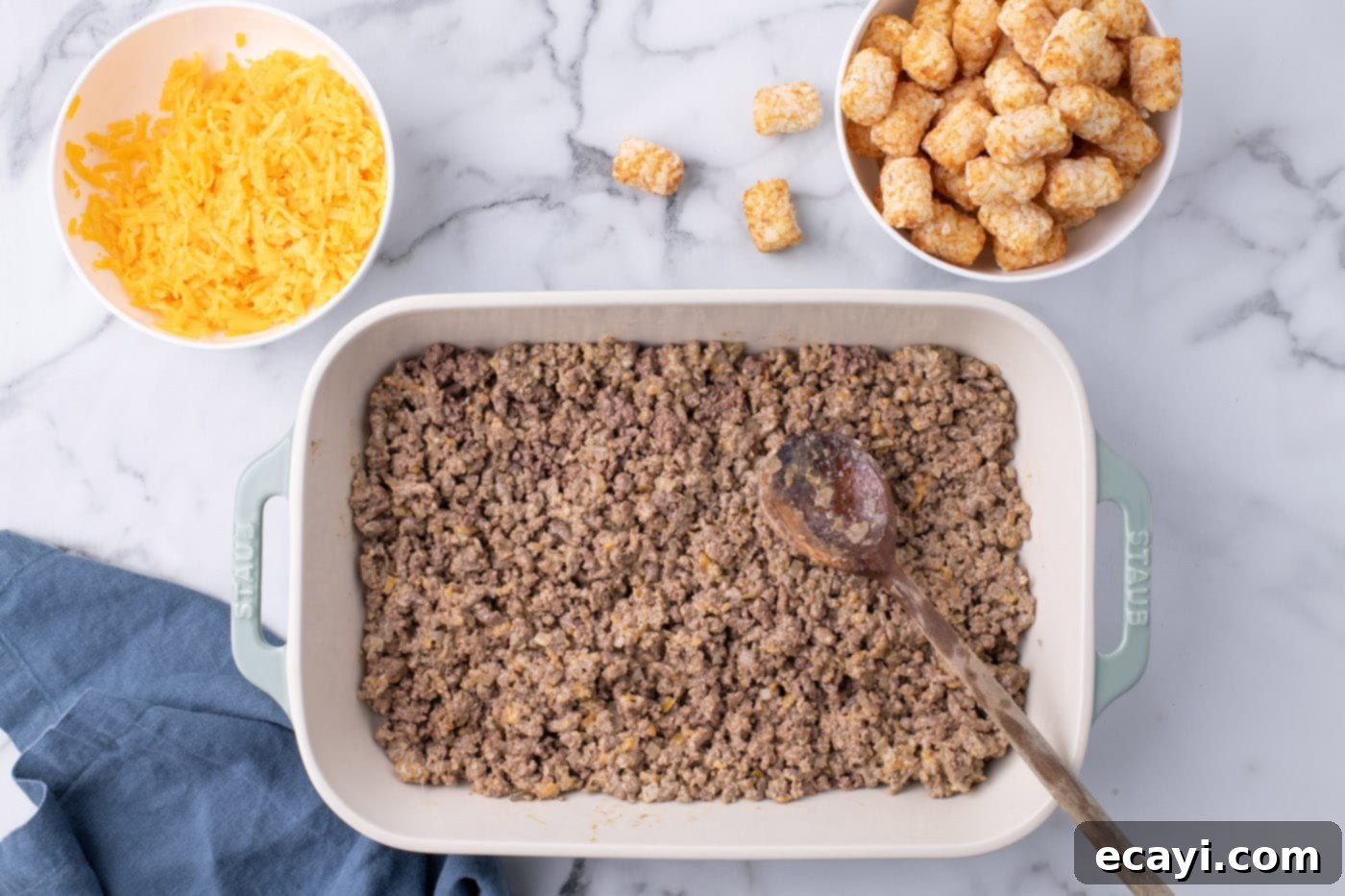 Special Sauce Cheeseburger Casserole 10 spreading ground beef mixture evenly in a casserole dish