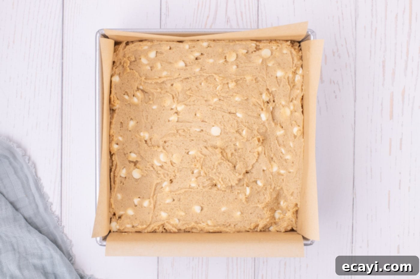 Chewy Blondie Bars 11 browned butter blondie batter in a baking pan