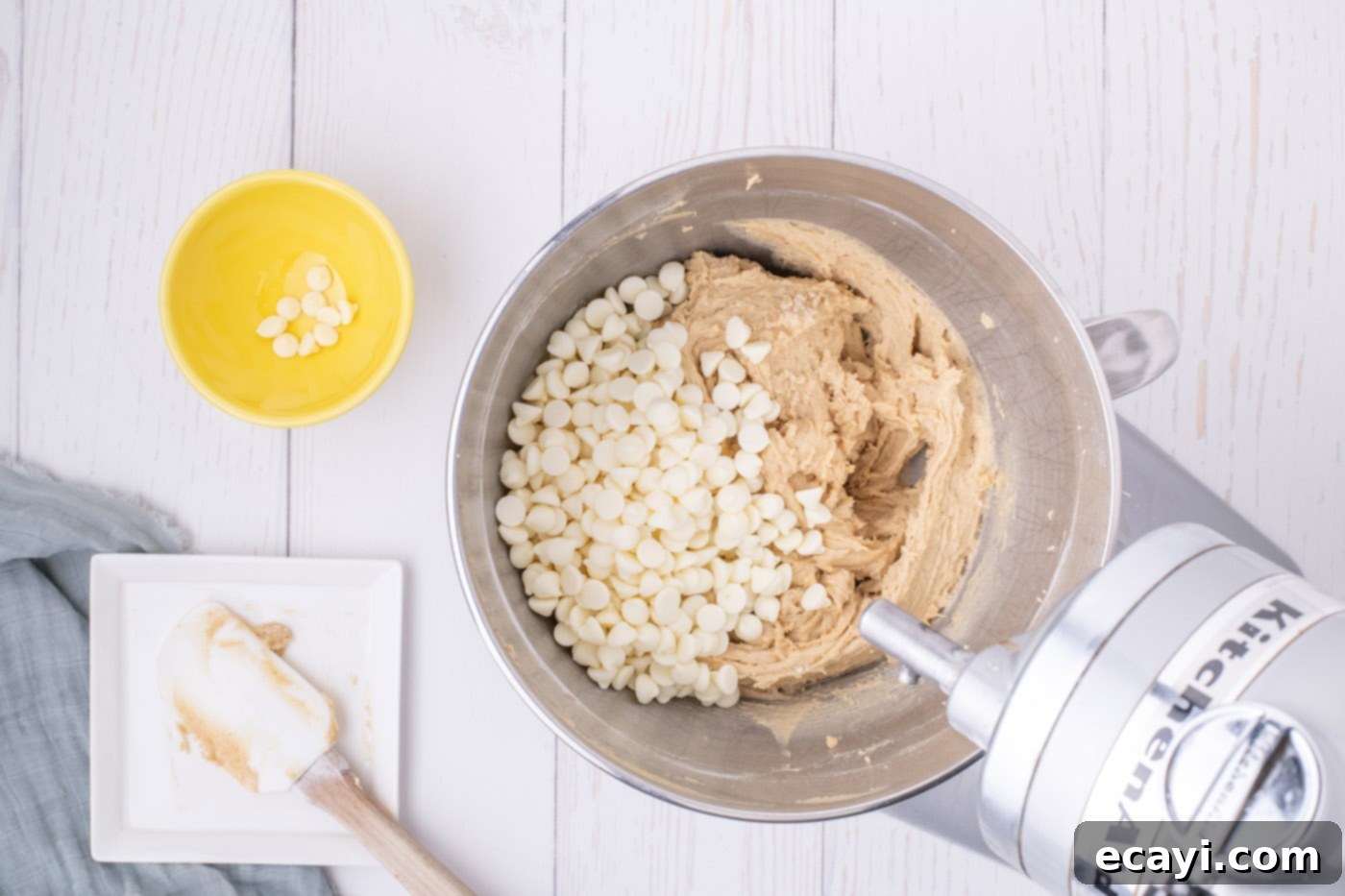 Chewy Blondie Bars 10 white chocolate chips in bowl of browned butter blondie batter