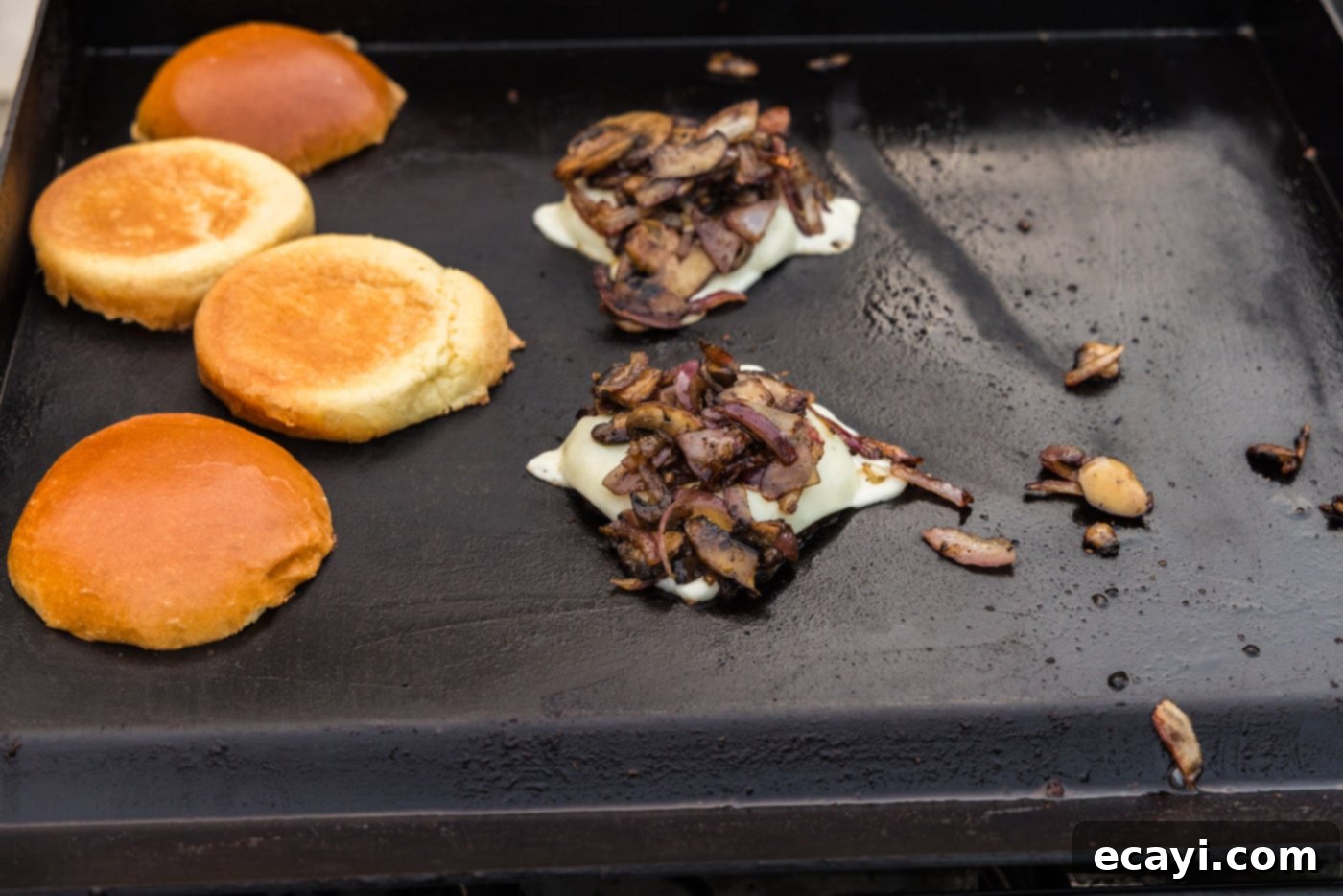 Mushroom Burger 14 sliced mozzarella on top of portobello mushroom caps with sliced mushrooms on top