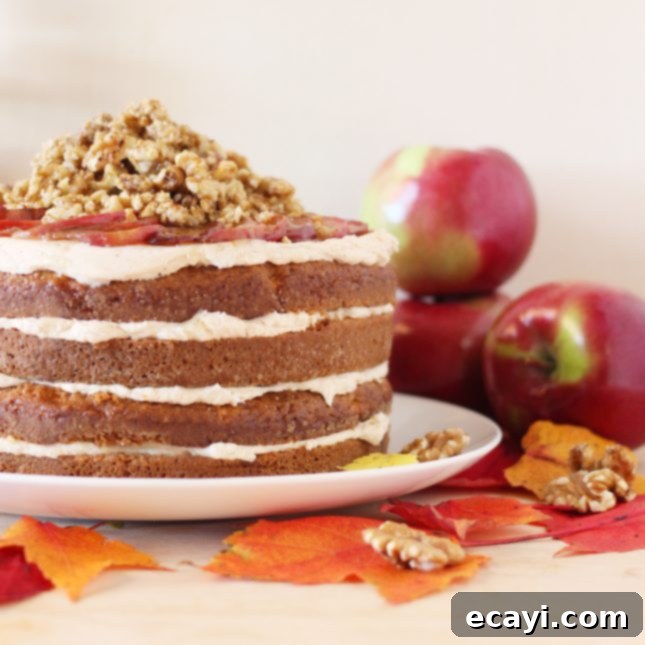 Tender Apple Layers with Velvety Caramel Apple Frosting and Toasted Maple Walnut Streusel 3 Close-up of a slice of Layered Apple Cake revealing its moist texture and apple pieces