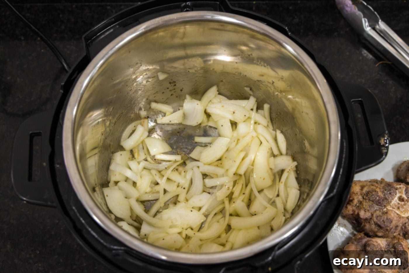 Instant Pot Fall-Off-The-Bone Oxtail 7 sliced onions sauteed in instant pot
