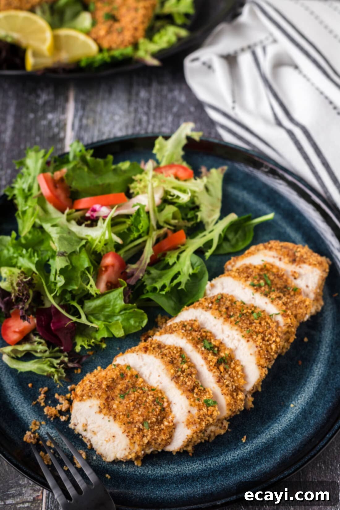 Golden Almond Chicken 2 Almond Crusted Chicken on a plate cut into slices